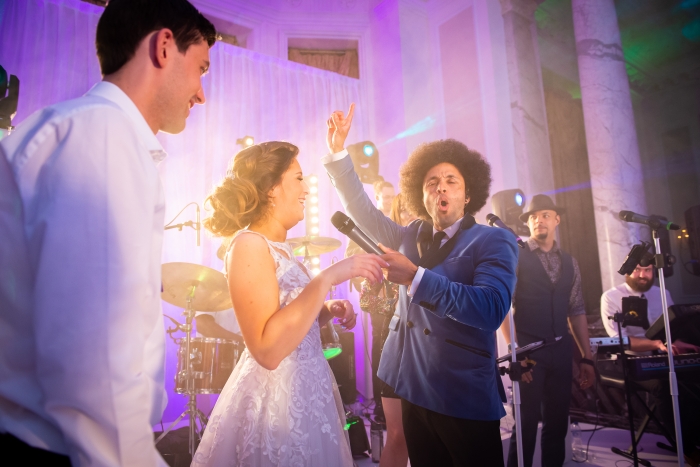 Bride and Groom Singing On Stage