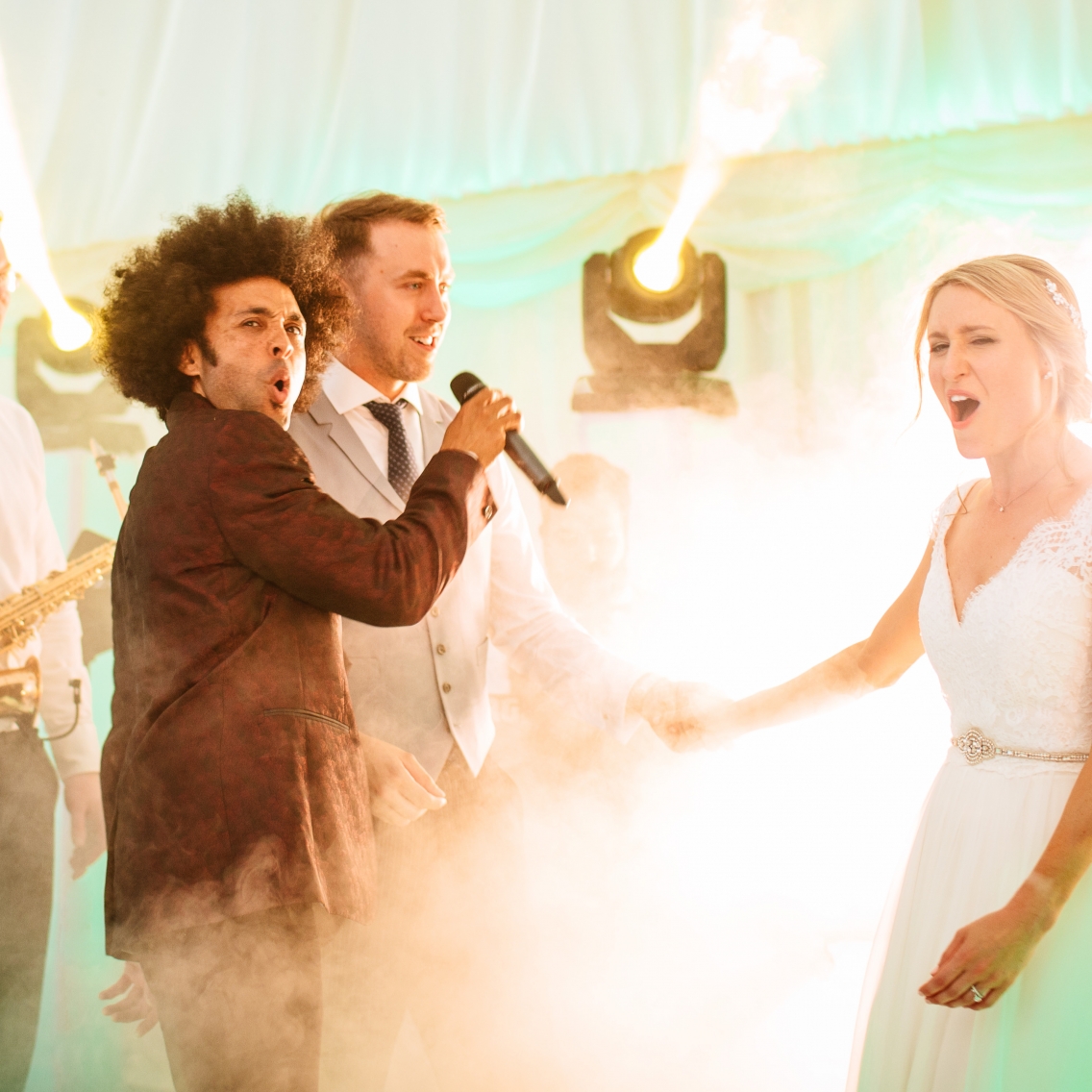 bride and groom singing at their wedding