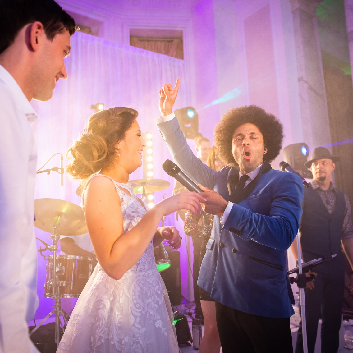 Bride and Groom Singing On Stage