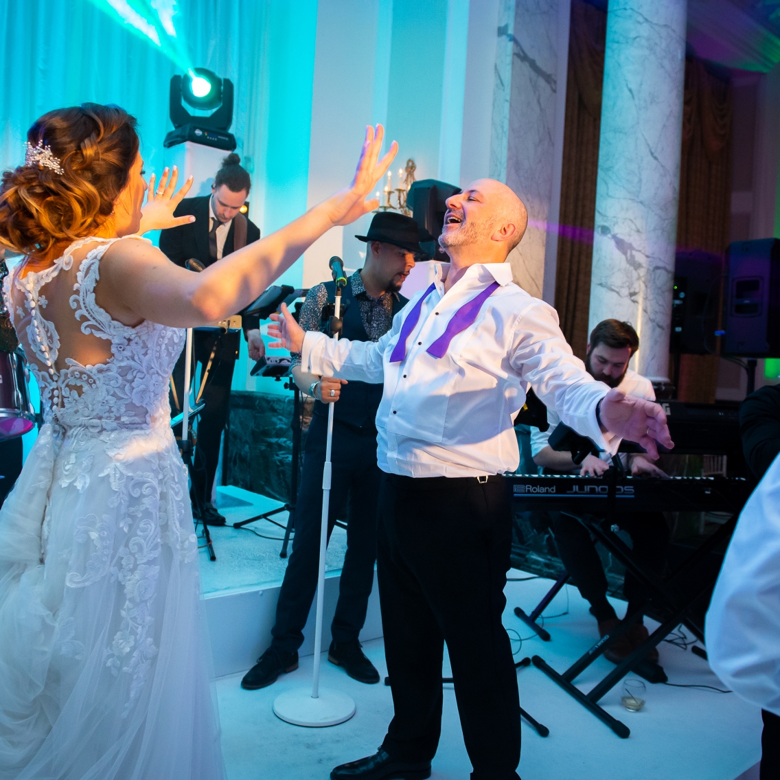 Dad and Daughter Singing On Stage