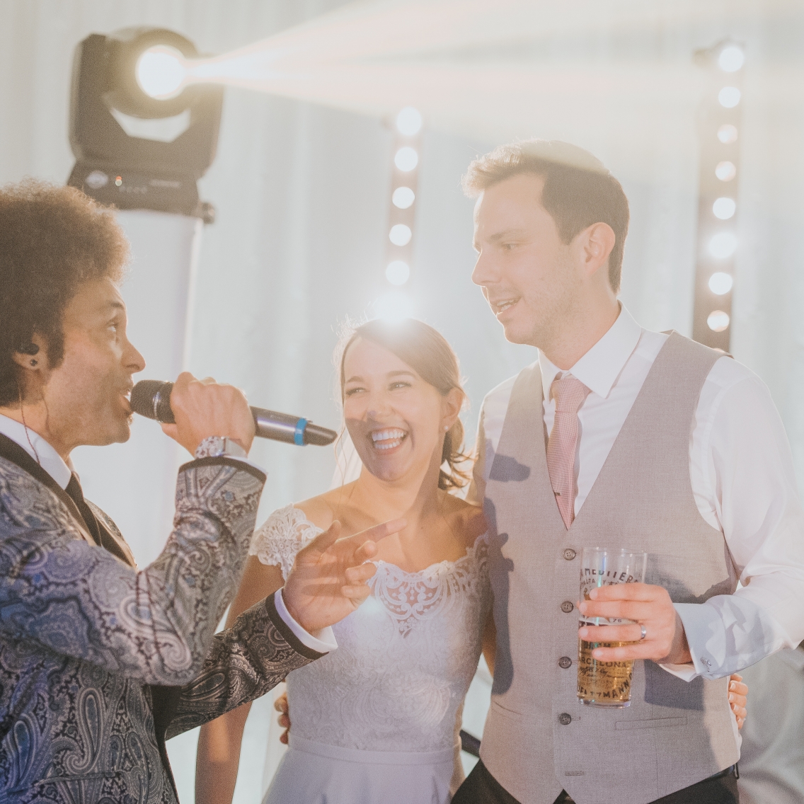 Bride and Groom on stage interacting Parklands Quendon Hall